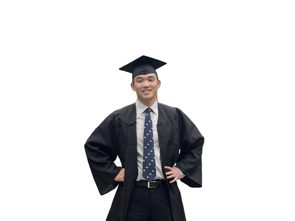 Kevin in cap and gown at the University of Michigan Law Quad